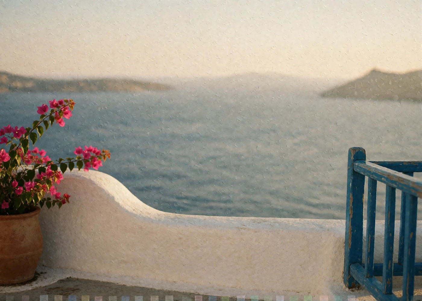 Whitewashed Greek island terrace overlooking the Aegean Sea with bougainvillea in bloom